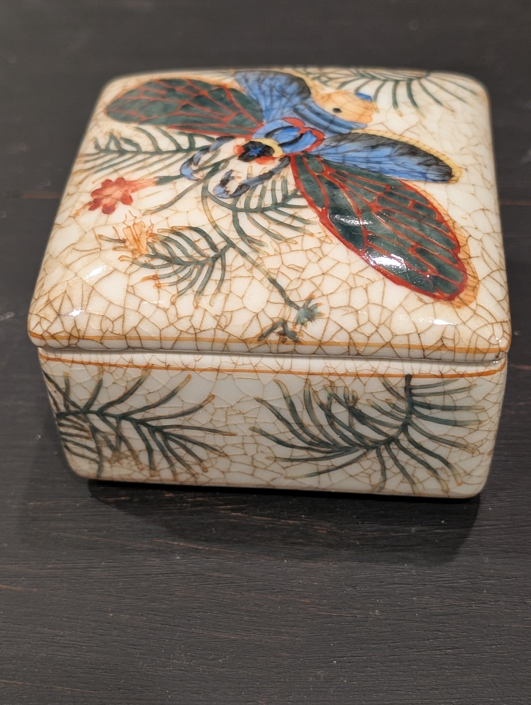 HomArt square porcelain box with blue and teal winged insect on lid and gold-tone rim