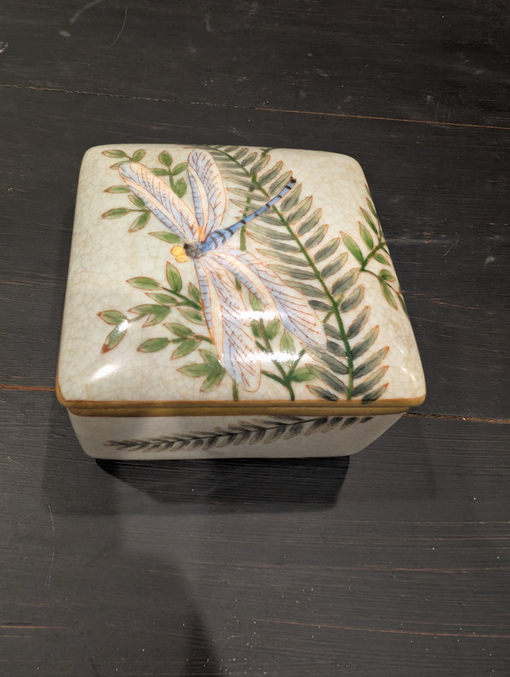 Close-up of HomArt Morning Fern porcelain box lid with hand-painted dragonfly and fern fronds